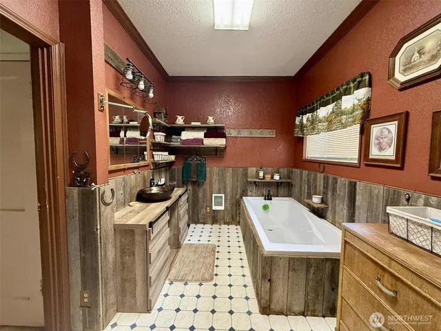 a bathroom with a sink a mirror and shower