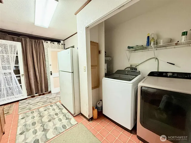 a view of a storage and utility room with a sink