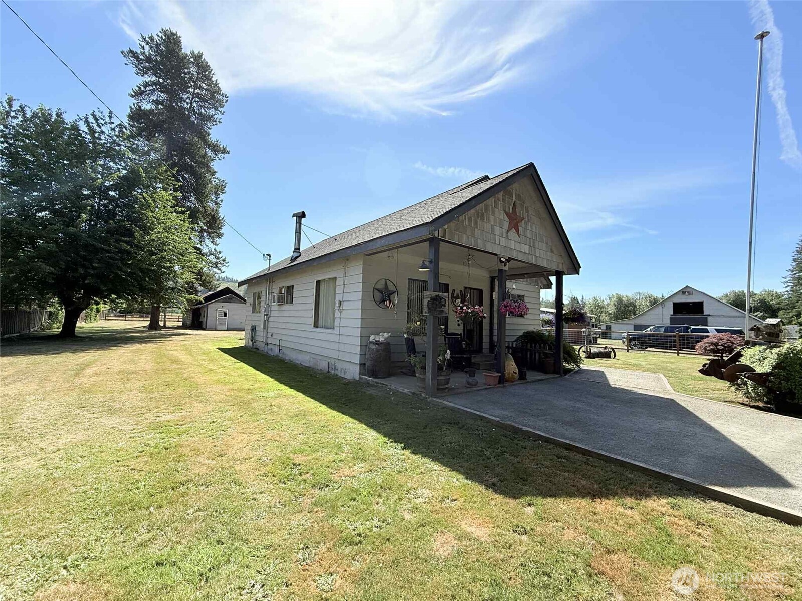 15 Heise Road South Elma, WA 98541 - Photo 2 of 40 a front view of a house with yard patio and fire pit