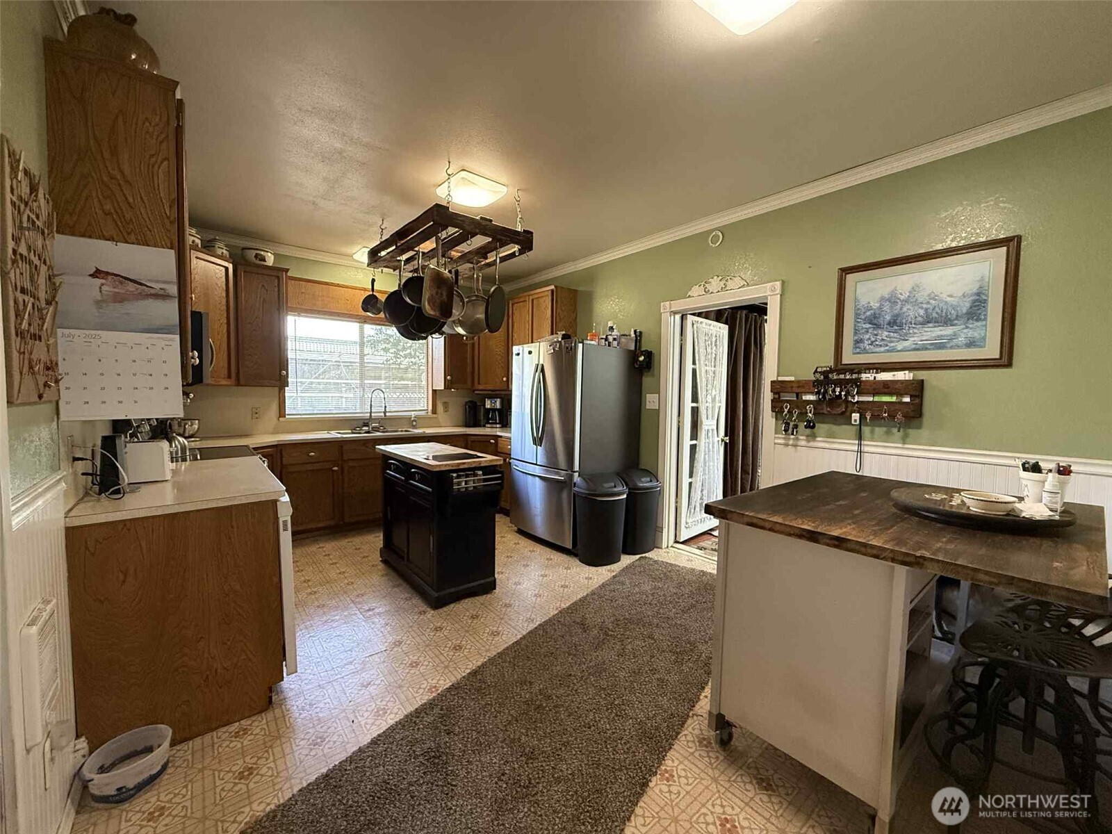 15 Heise Road South Elma, WA 98541 - Photo 8 of 40 a kitchen with a sink stove and refrigerator
