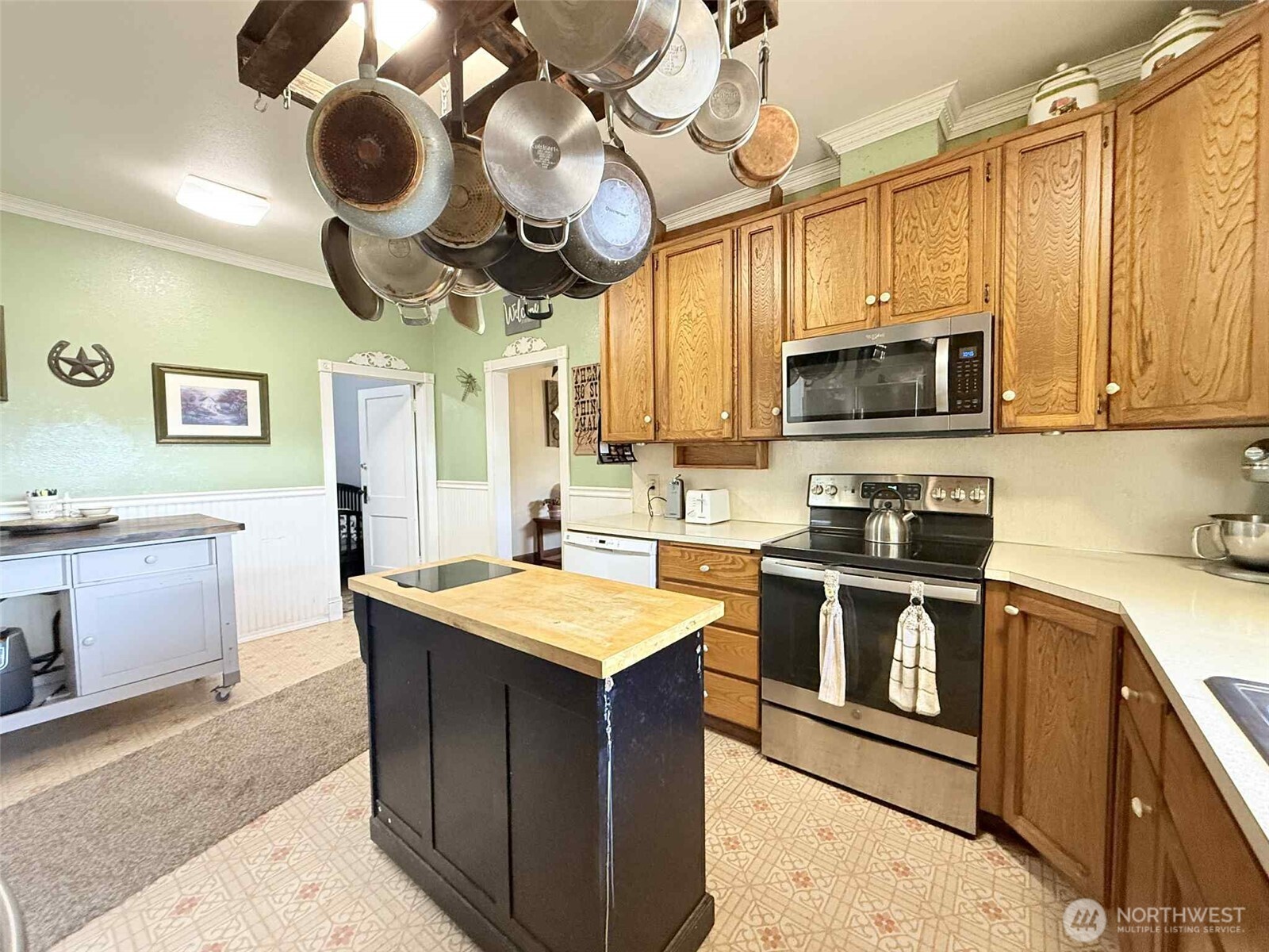 15 Heise Road South Elma, WA 98541 - Photo 10 of 40 a kitchen with a stove cabinets and stainless steel appliances