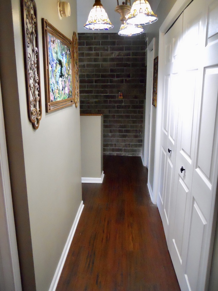 108 Kenneth Circle Elgin, IL 60120 - Photo 14 of 28 a view of hallway with wooden floor and stairs