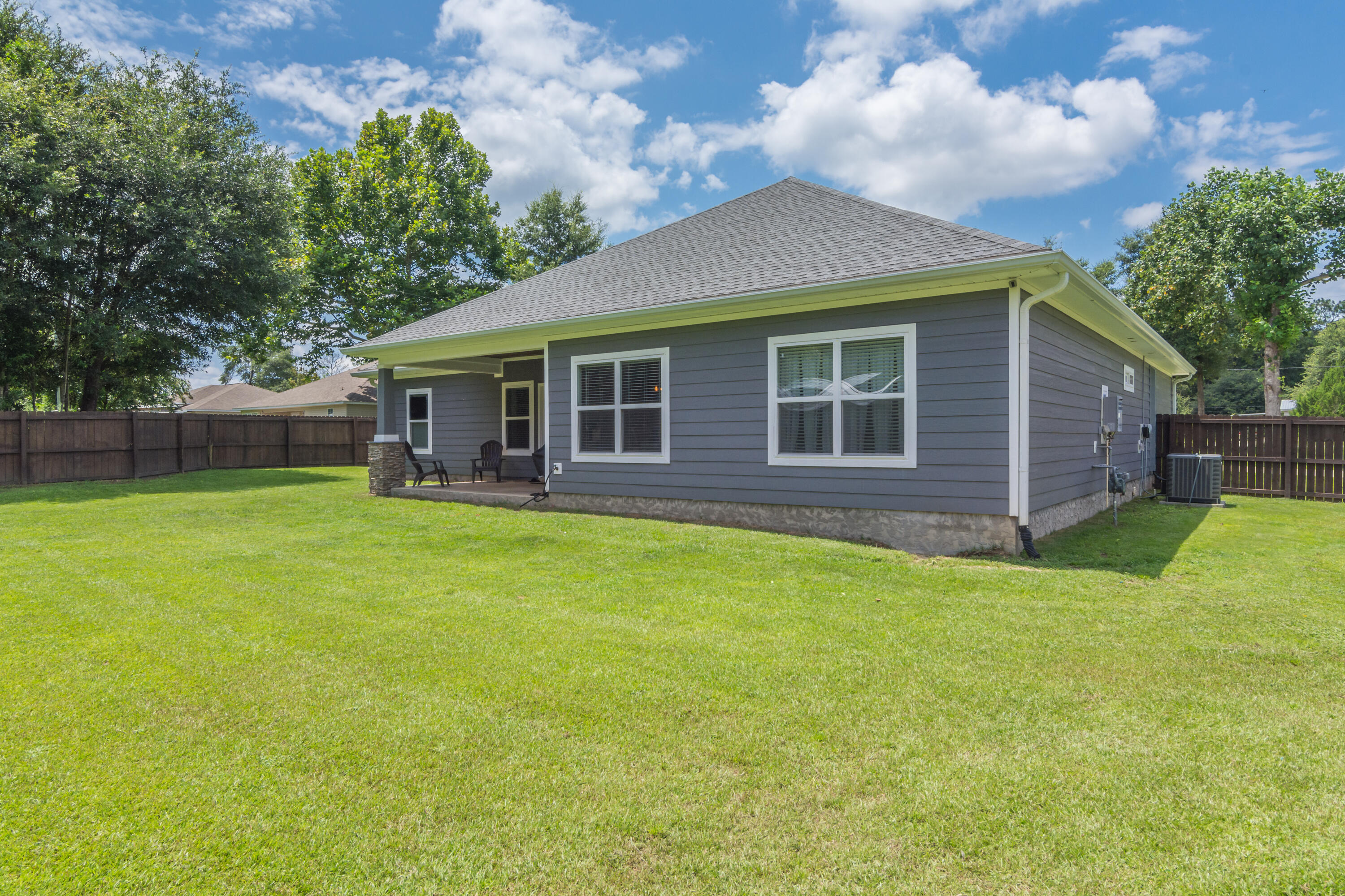 6117 Old Hickory Road Crestview, FL 32539 - Photo 28 of 32 a view of a house with a backyard