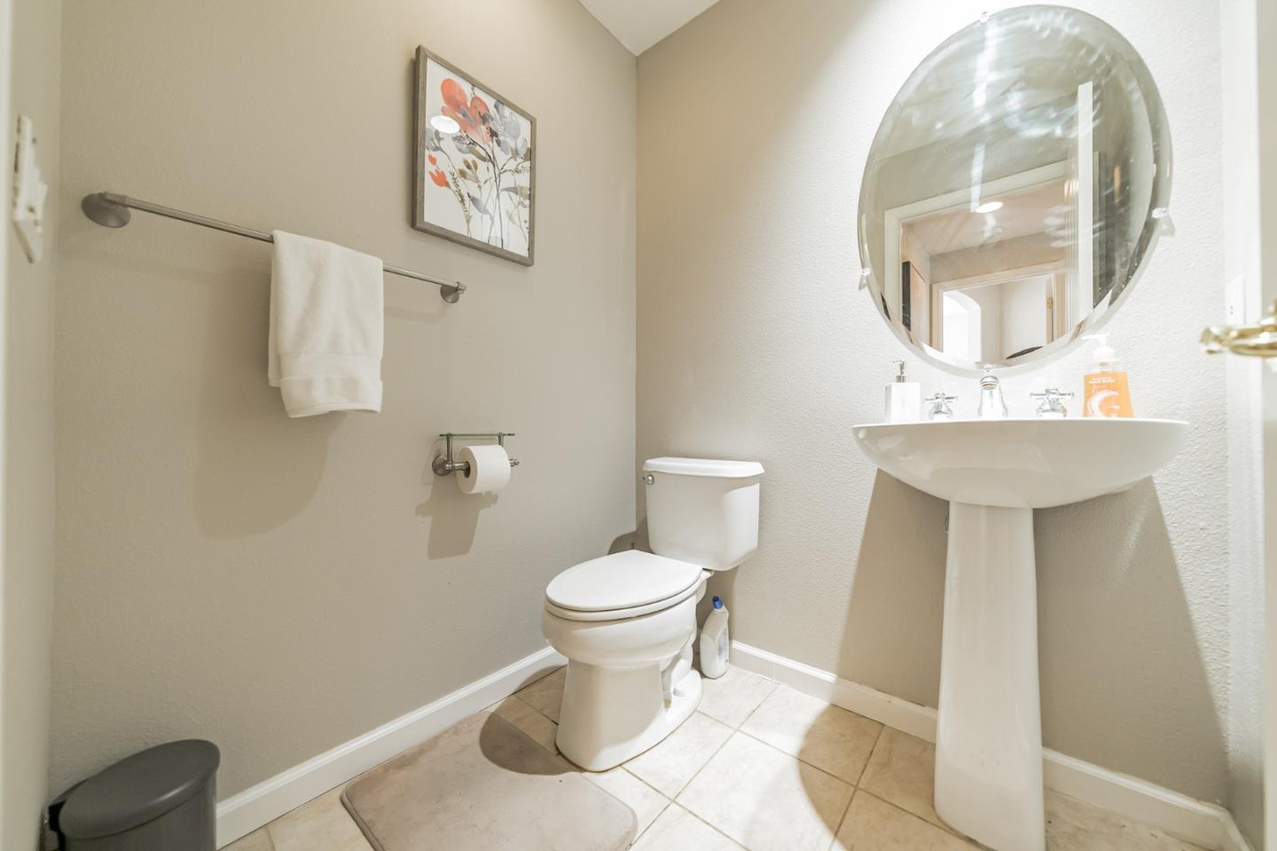 1193 South Chanterella Drive San Ramon, CA 94582 - Photo 14 of 45 a bathroom with a toilet sink and mirror