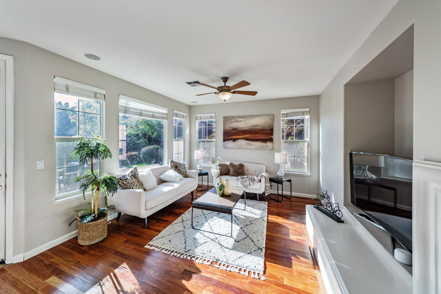 1193 South Chanterella Drive San Ramon, CA 94582 - Photo 20 of 45 a living room with furniture wooden floor and a fireplace