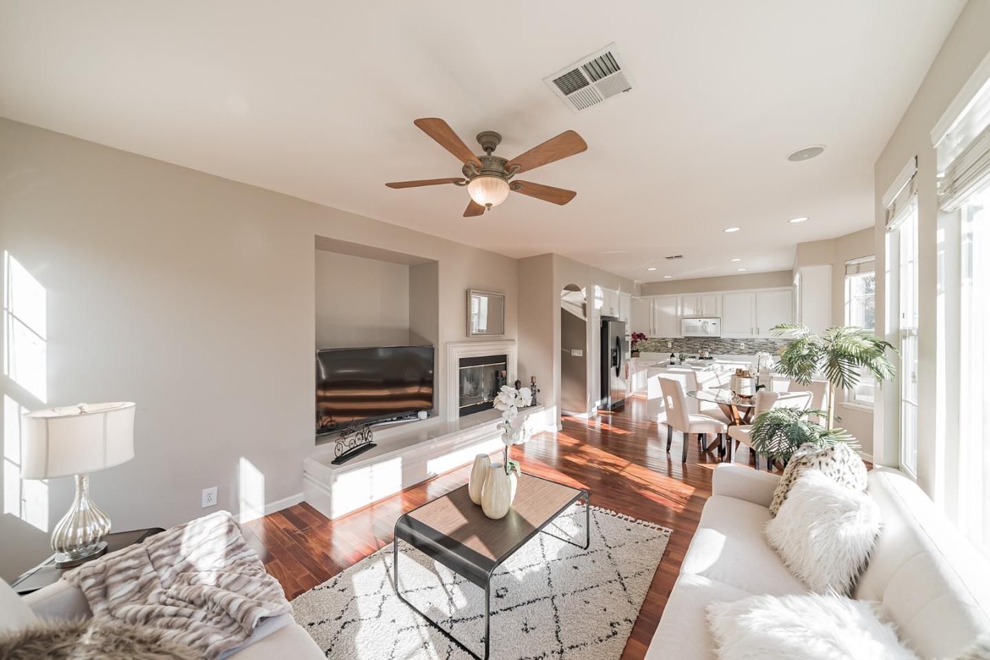 1193 South Chanterella Drive San Ramon, CA 94582 - Photo 22 of 45 a living room with furniture a ceiling fan and a flat screen tv