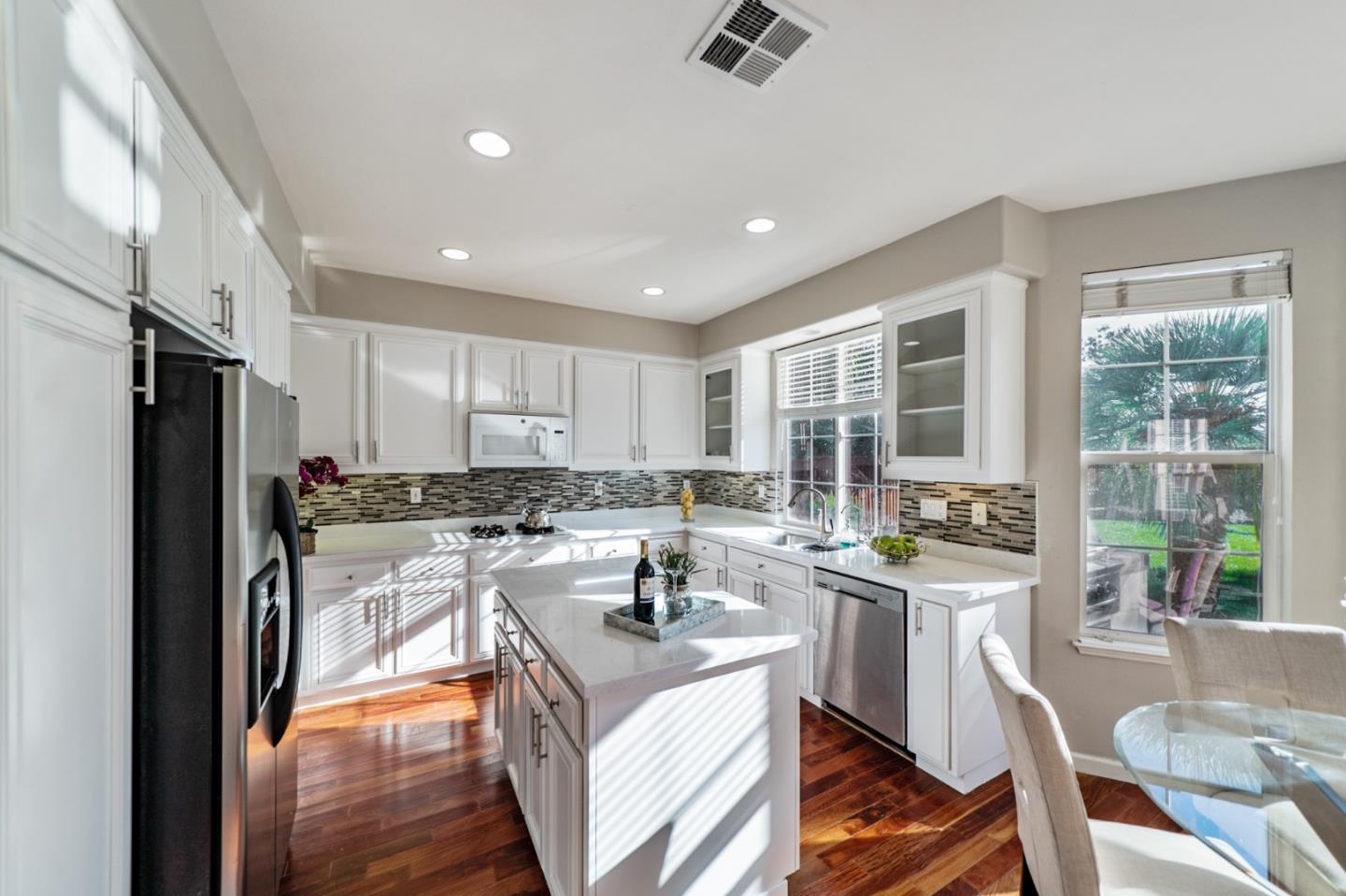 1193 South Chanterella Drive San Ramon, CA 94582 - Photo 24 of 45 a kitchen with a sink a counter top space a refrigerator and cabinets