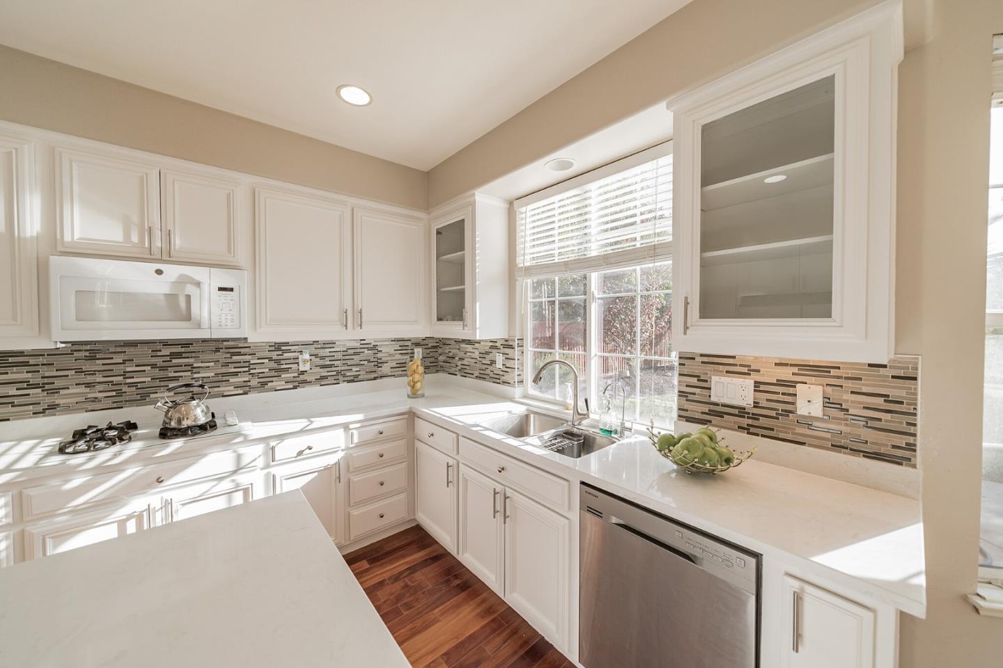1193 South Chanterella Drive San Ramon, CA 94582 - Photo 25 of 45 a kitchen with a sink stove and cabinets
