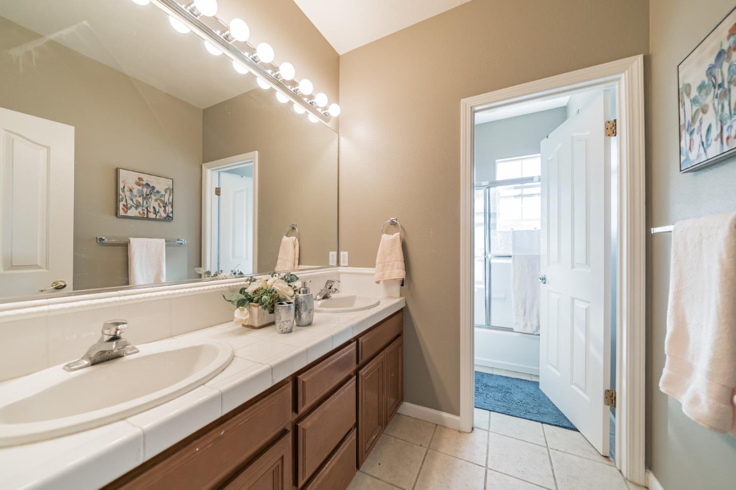 1193 South Chanterella Drive San Ramon, CA 94582 - Photo 29 of 45 a bathroom with a sink and a mirror