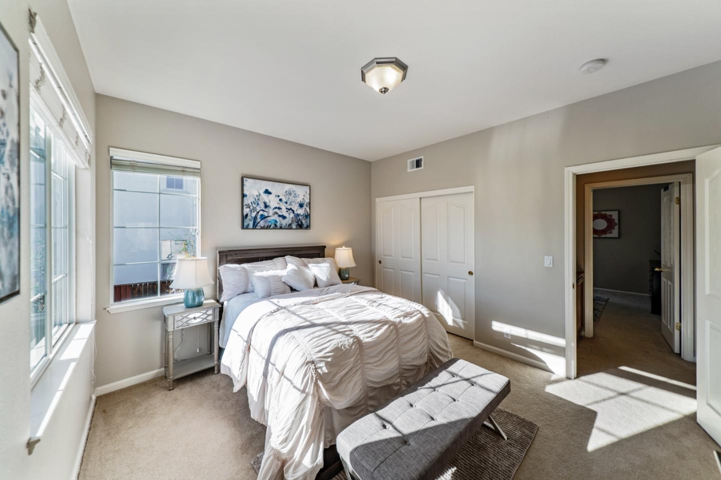 1193 South Chanterella Drive San Ramon, CA 94582 - Photo 35 of 45 a bedroom with a bed and a chandelier