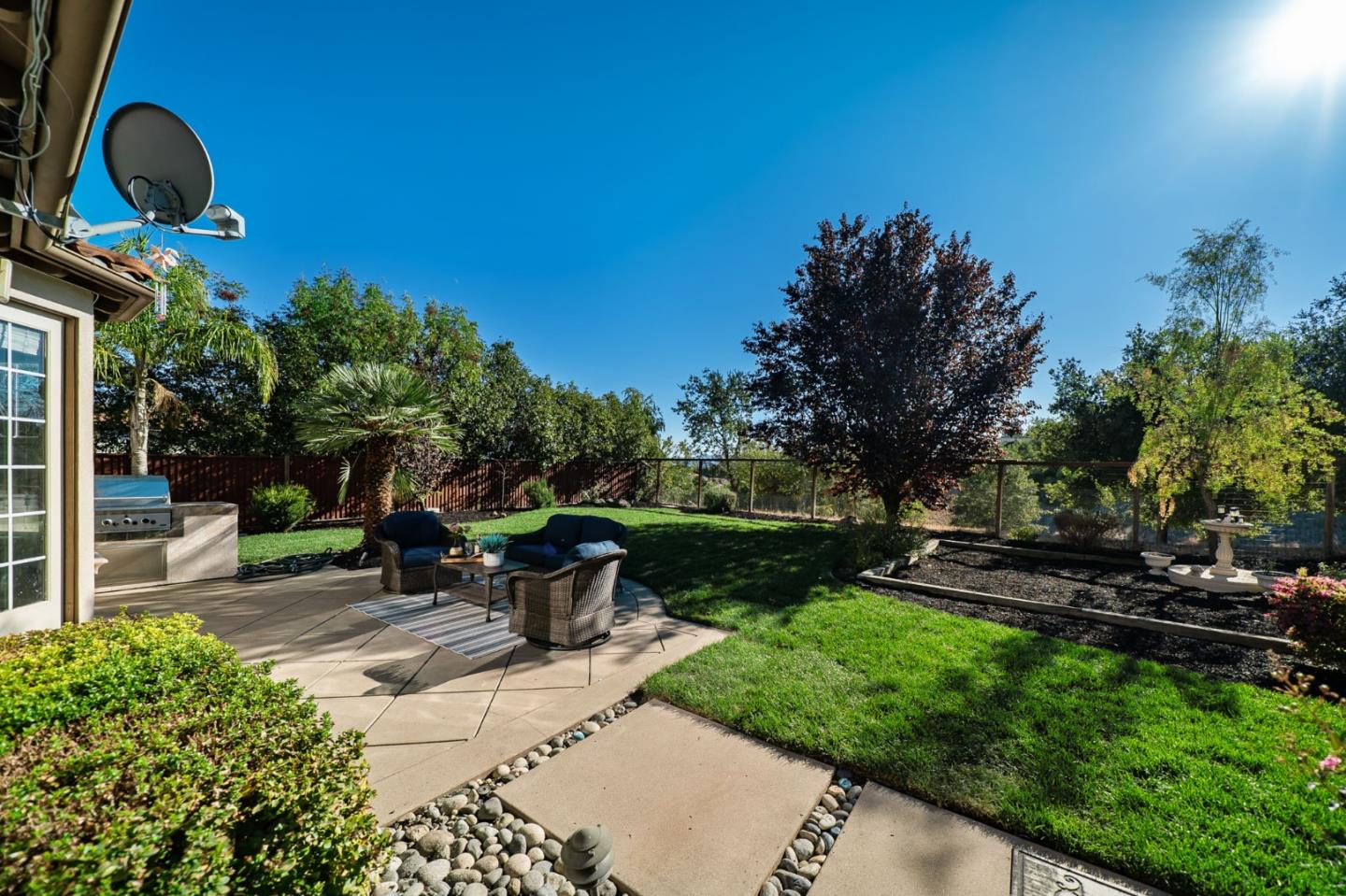 1193 South Chanterella Drive San Ramon, CA 94582 - Photo 6 of 45 a view of a chair and table in backyard of the house