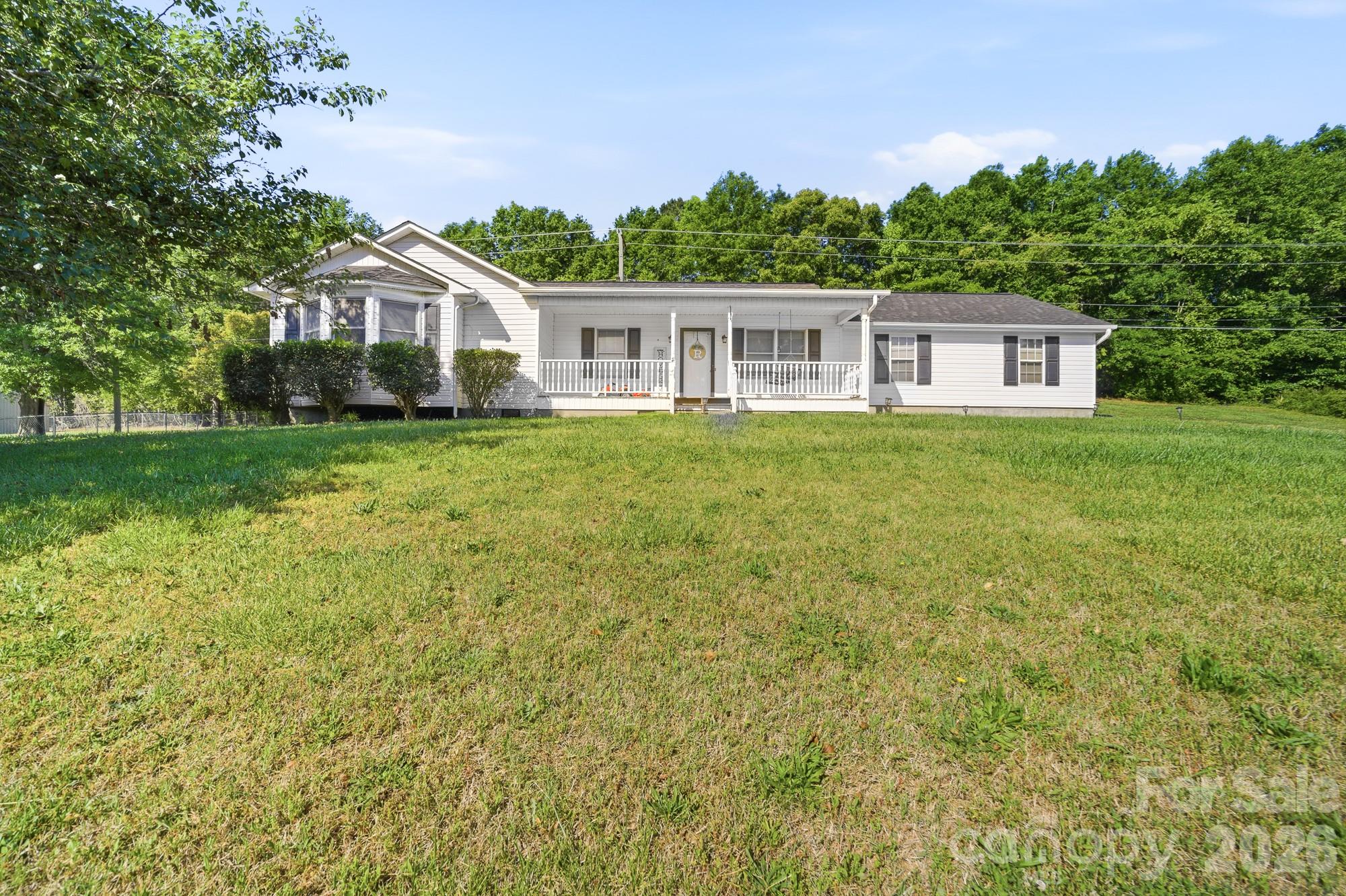 248 Jack McKinney Road Forest City, NC 28043 - Photo 2 of 29 a front view of a house with a garden