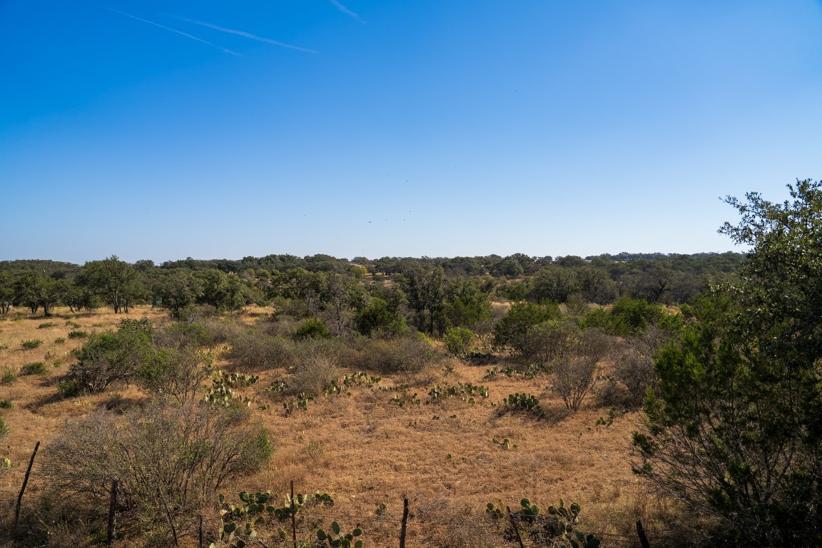 928 Bendele Road Johnson City, TX 78636 - Photo 1 of 31 a view of a lake with mountains in the background