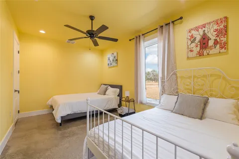 a bedroom with a bed and wall painting