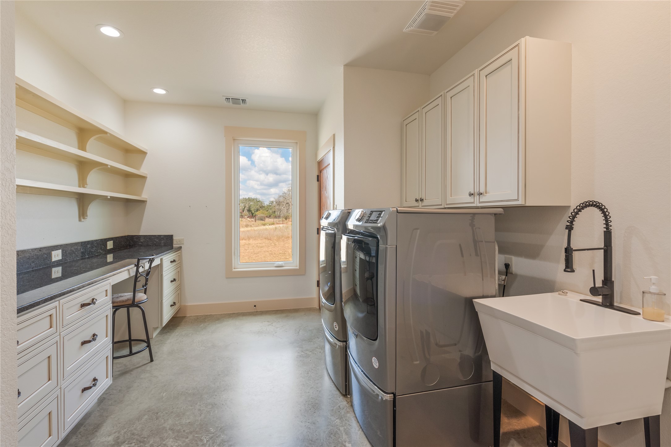 928 Bendele Road Johnson City, TX 78636 - Photo 15 of 31 a kitchen with a sink appliances and cabinets