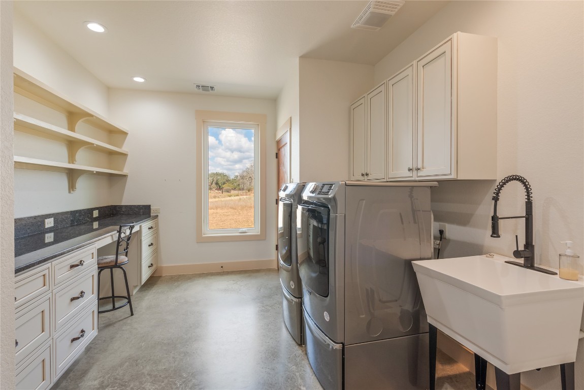 928 Bendele Road Johnson City, TX 78636 - Photo 15 of 31 a kitchen with a sink appliances and cabinets