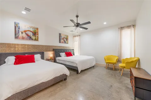 a bedroom with a bed and a table