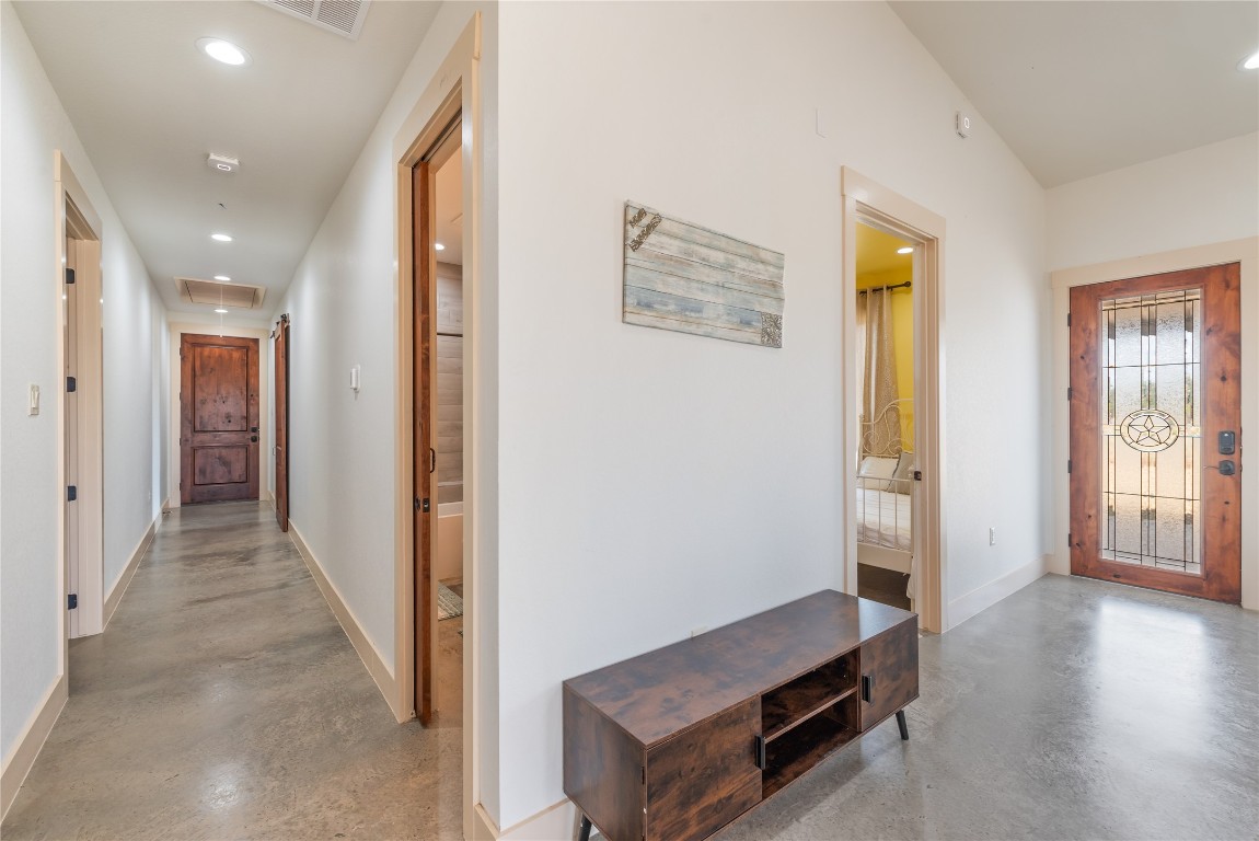928 Bendele Road Johnson City, TX 78636 - Photo 20 of 31 a view of a hallway with interior of the house
