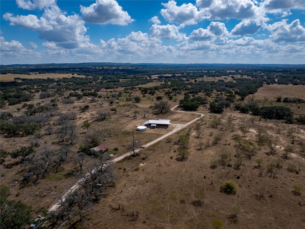 928 Bendele Road Johnson City, TX 78636 - Photo 23 of 31 a view of a dry yard with wooden fence