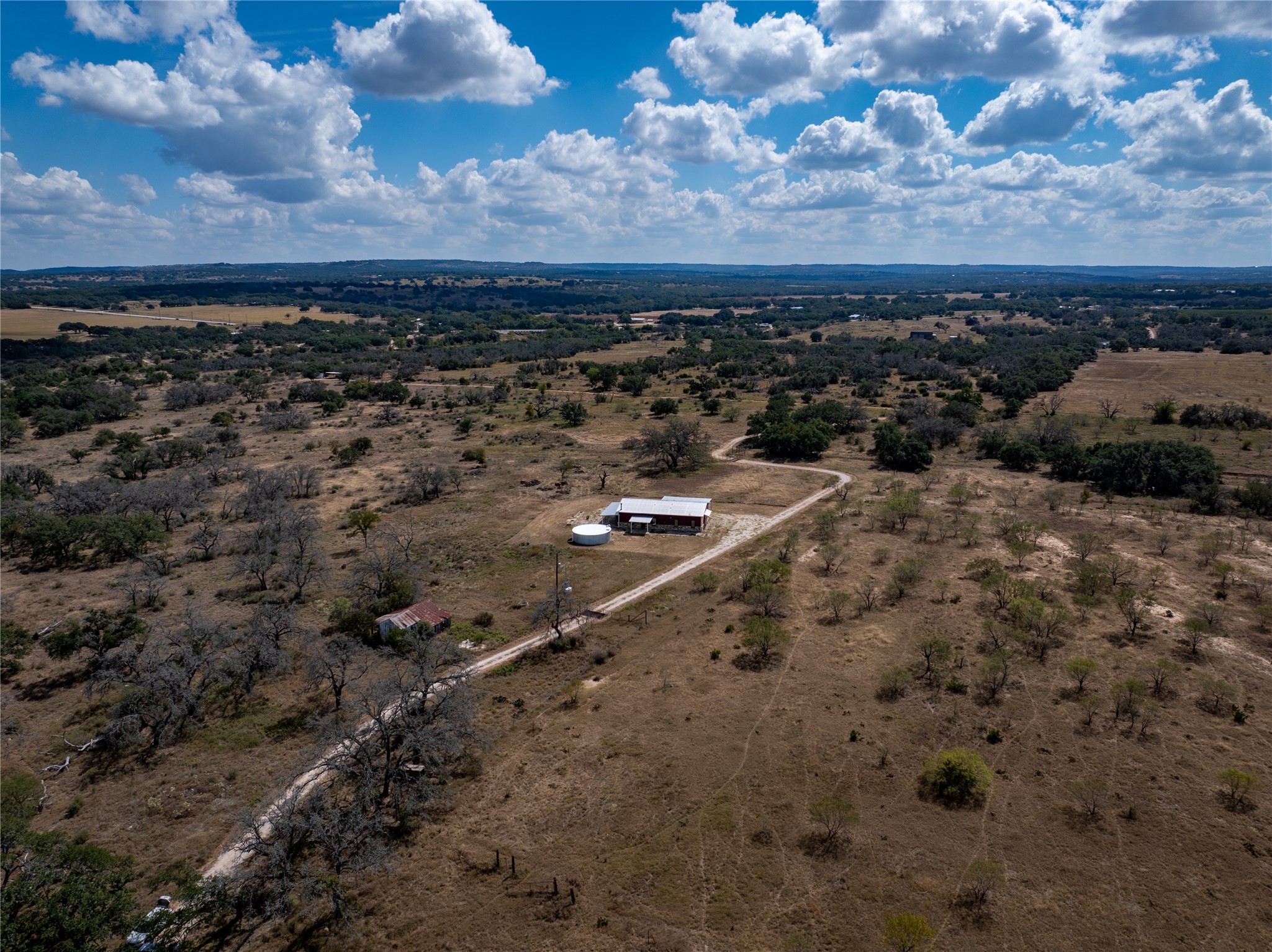 928 Bendele Road Johnson City, TX 78636 - Photo 23 of 31 a view of a dry yard with wooden fence