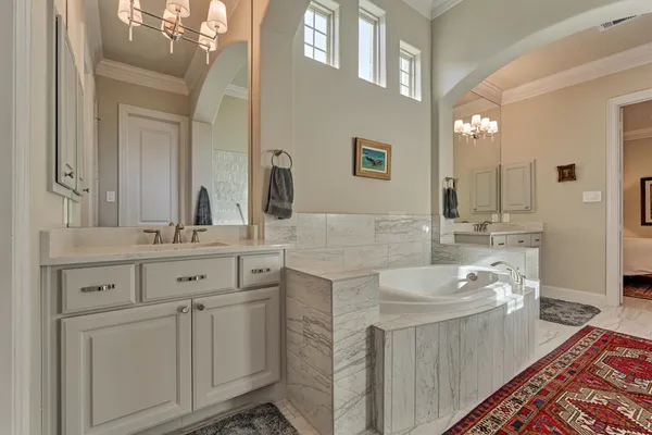 a bathroom with a double vanity sink mirror and