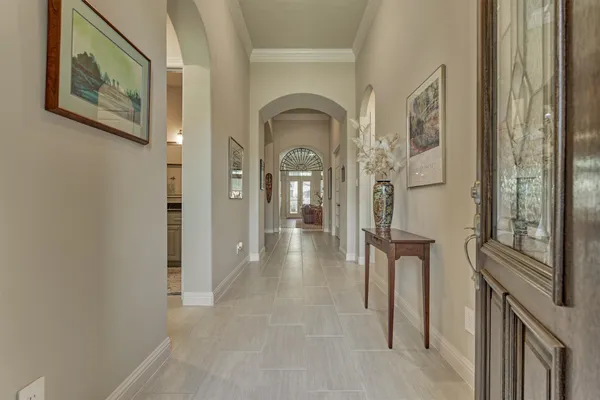 a view of a hallway with windows