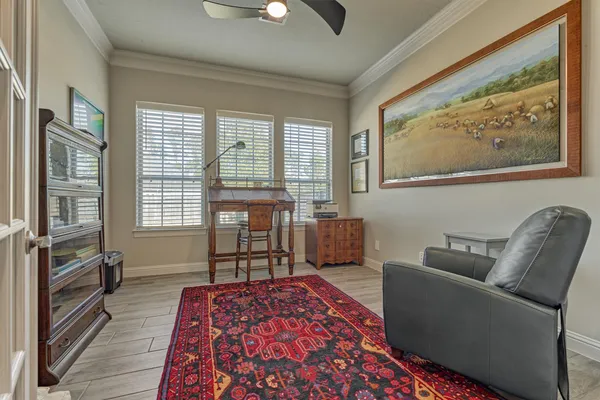 a bedroom with furniture and a window