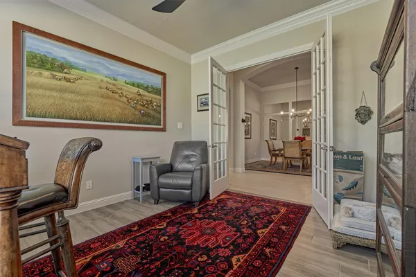 a bedroom with furniture and a rug