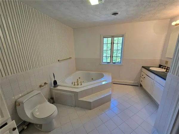 a bathroom with a bathtub and a shower