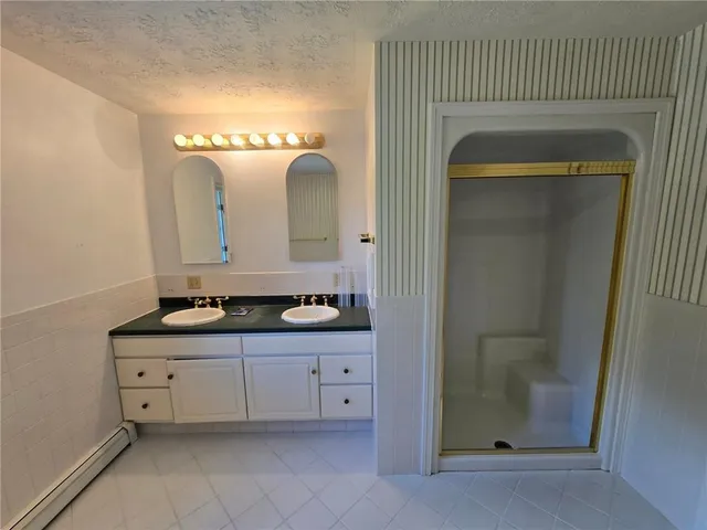 a bathroom with a bathtub and toilet