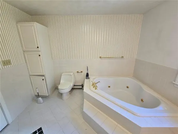 a view of an empty room with a staircase