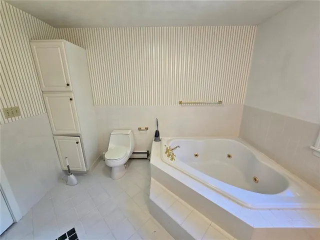 a view of an empty room with a staircase