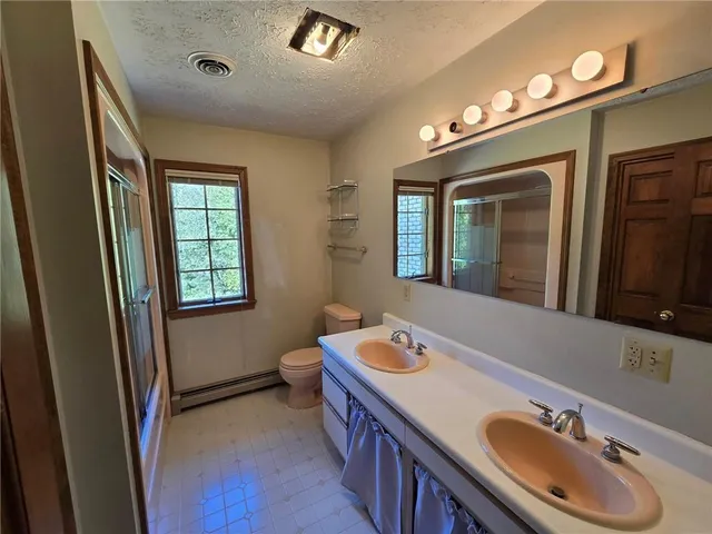 a bathroom with a glass door door