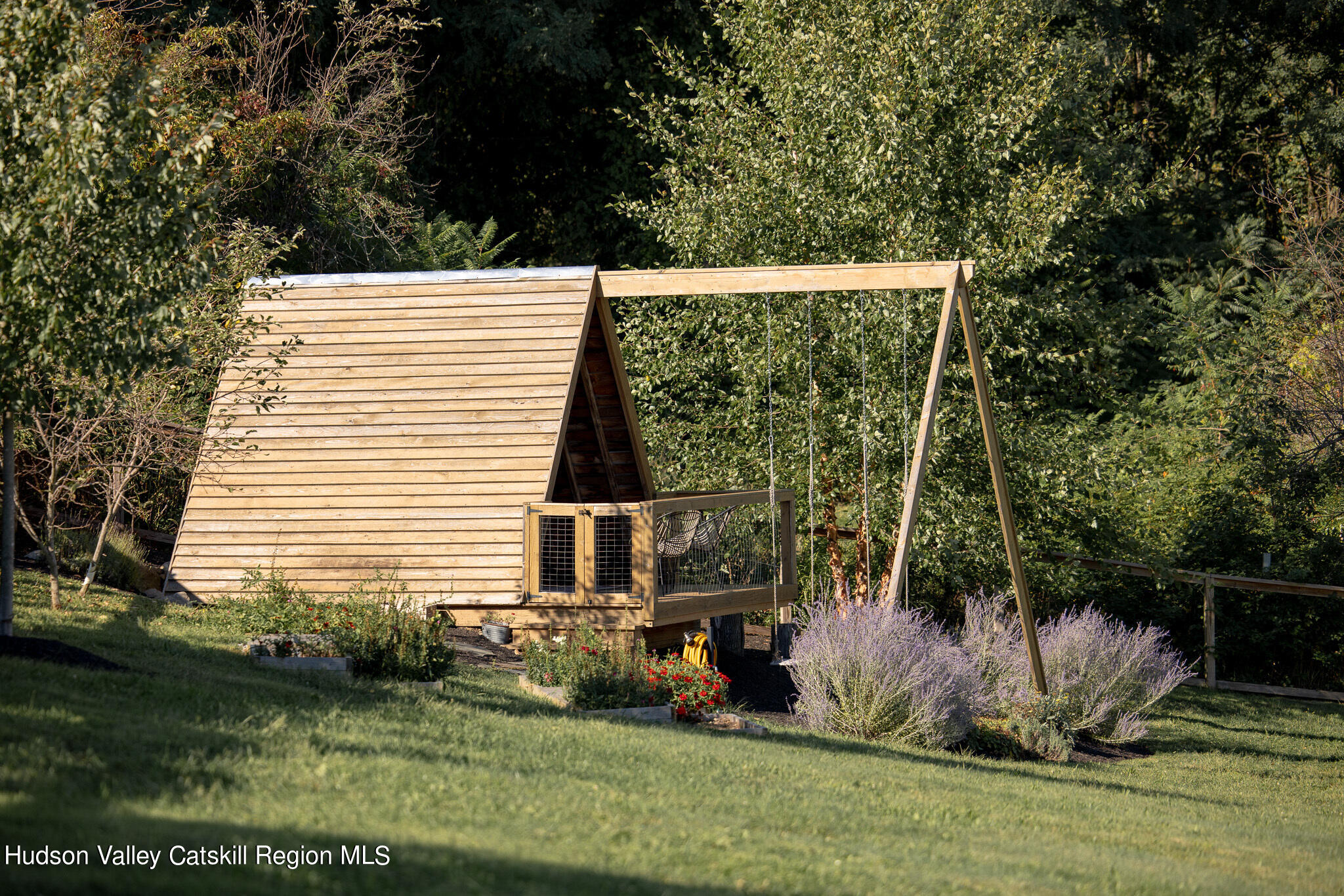 271 Ridge Road Milton, NY 12547 - Photo 22 of 29 a view of a backyard with plants and large trees
