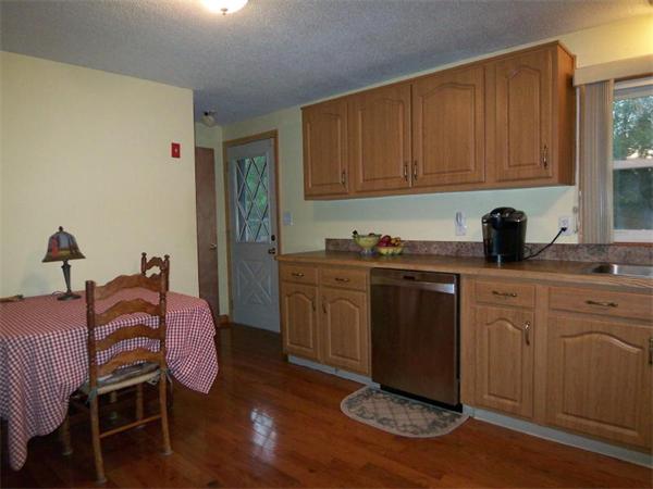 55 School House Road Phillipston, MA 01331 - Photo 4 of 17 a kitchen with a sink cabinets and wooden floor