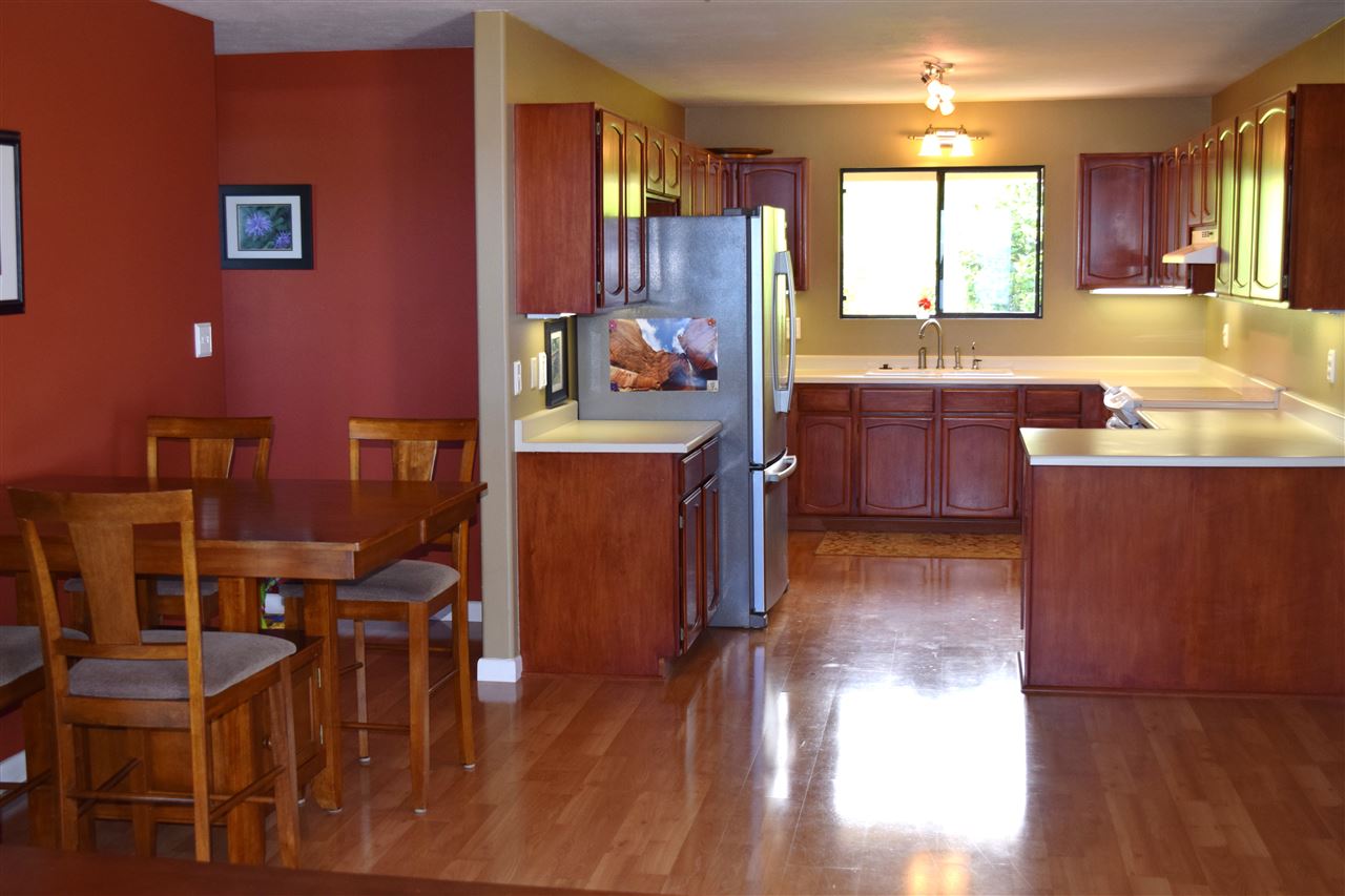 5011 Lower Kula Road Kula, HI 96790 - Photo 4 of 14 a kitchen with cabinets a counter space and a dining table