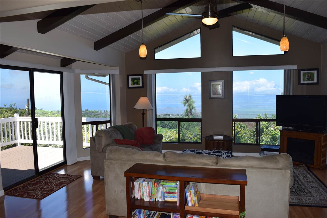 5011 Lower Kula Road Kula, HI 96790 - Photo 7 of 14 a living room with furniture a flat screen tv and large windows