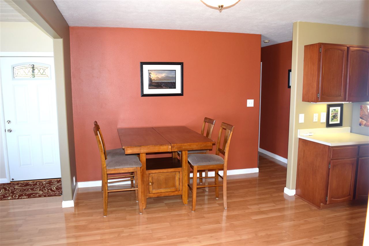 5011 Lower Kula Road Kula, HI 96790 - Photo 8 of 14 a dining room with furniture and wooden floor