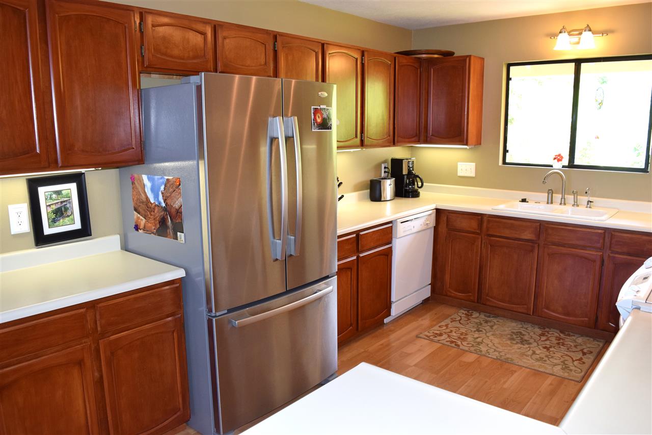 5011 Lower Kula Road Kula, HI 96790 - Photo 9 of 14 a kitchen with stainless steel appliances granite countertop a refrigerator sink and cabinets