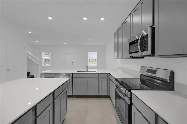a kitchen with lots of counter space and a sink