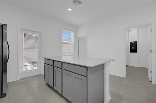 a view of kitchen with furniture and wooden floor