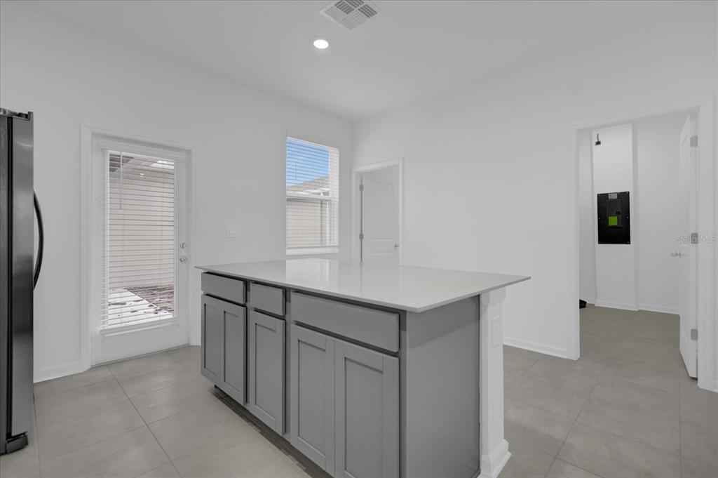 6049 Blissful Street Clermont, FL 34714 - Photo 12 of 25 a view of kitchen with furniture and wooden floor