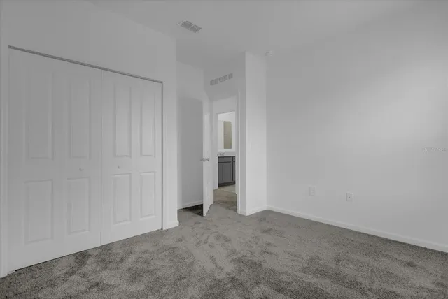 a view of an empty room and entryway