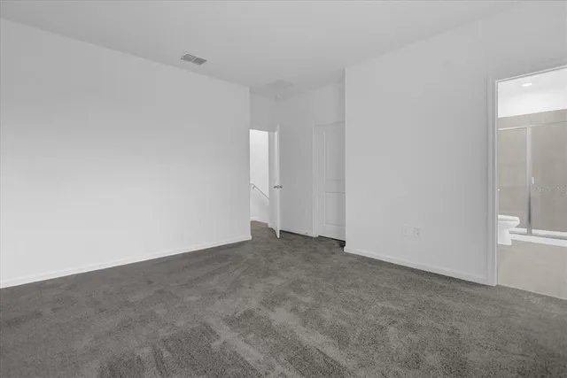 a view of an empty room and entryway