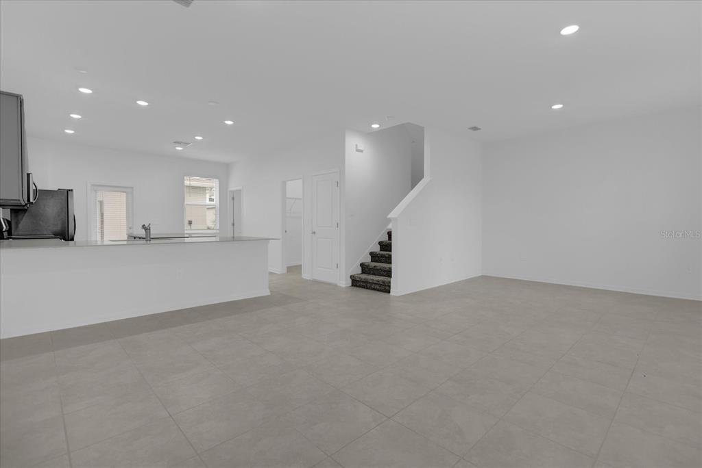 6049 Blissful Street Clermont, FL 34714 - Photo 7 of 25 a view of an empty room with a window