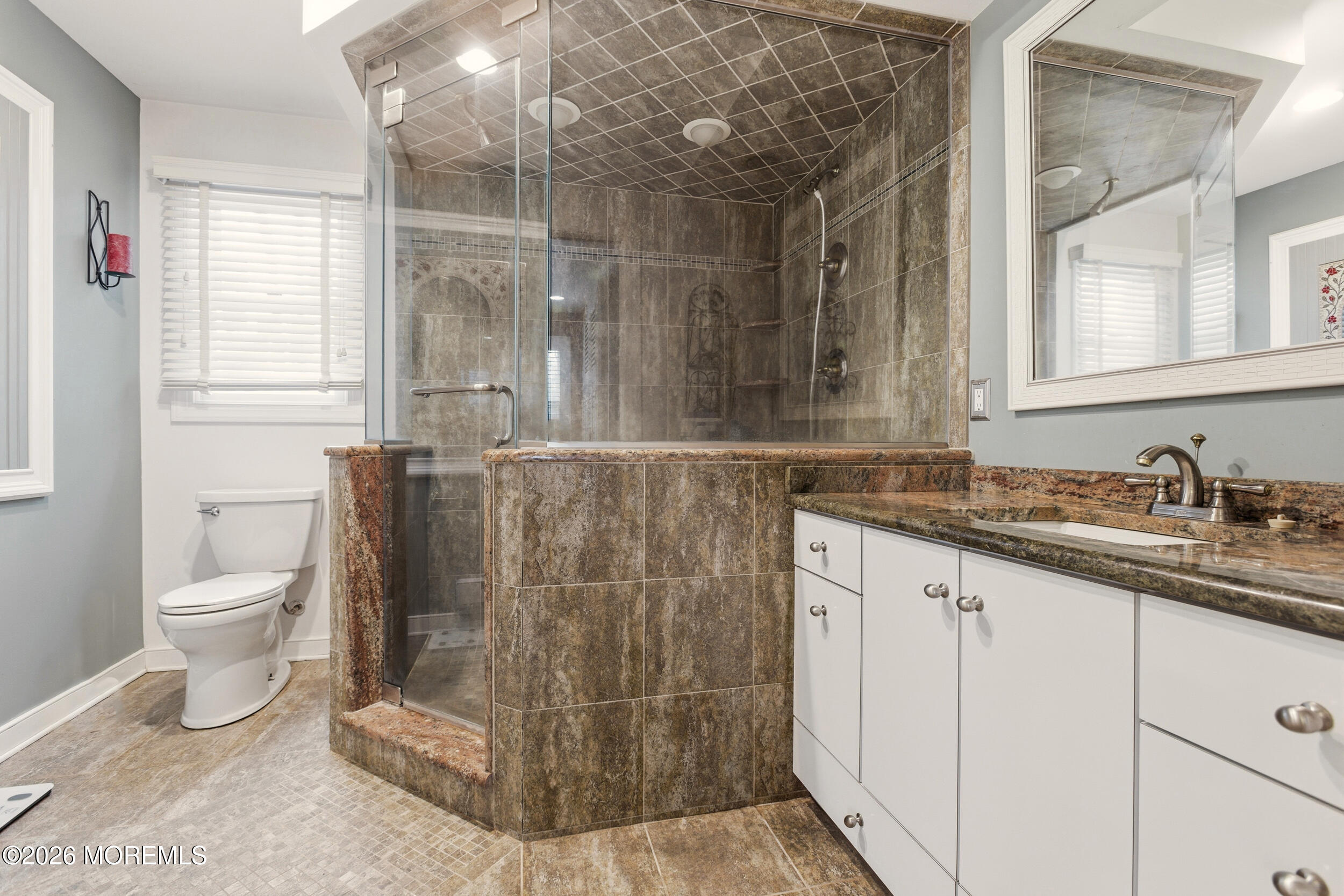 31 Chelsea Road Jackson, NJ 08527 - Photo 18 of 57 a bathroom with a sink and a mirror