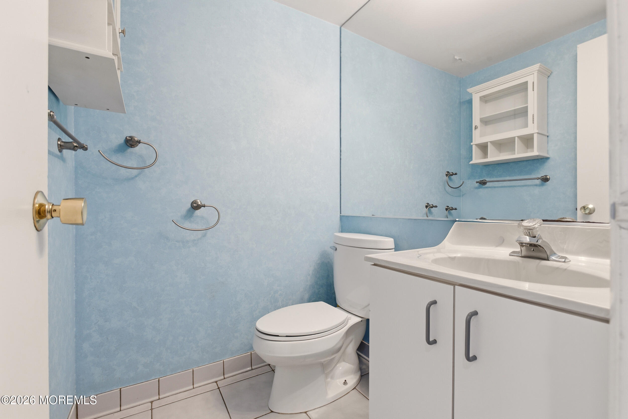 31 Chelsea Road Jackson, NJ 08527 - Photo 24 of 57 a bathroom with a toilet sink vanity and mirror