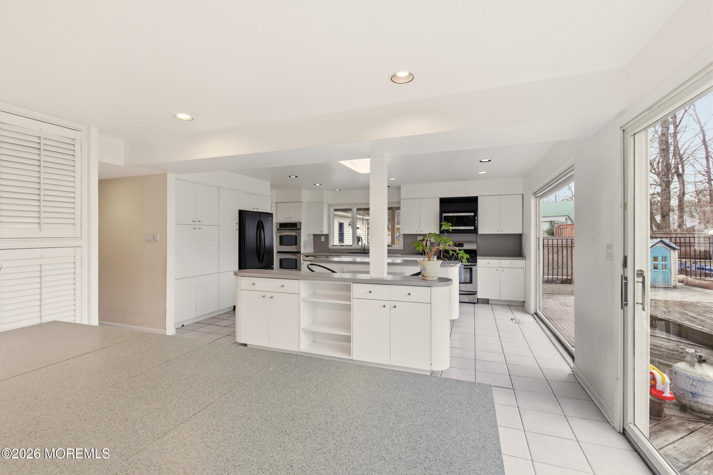 31 Chelsea Road Jackson, NJ 08527 - Photo 27 of 57 a view of a kitchen with sink microwave and cabinets