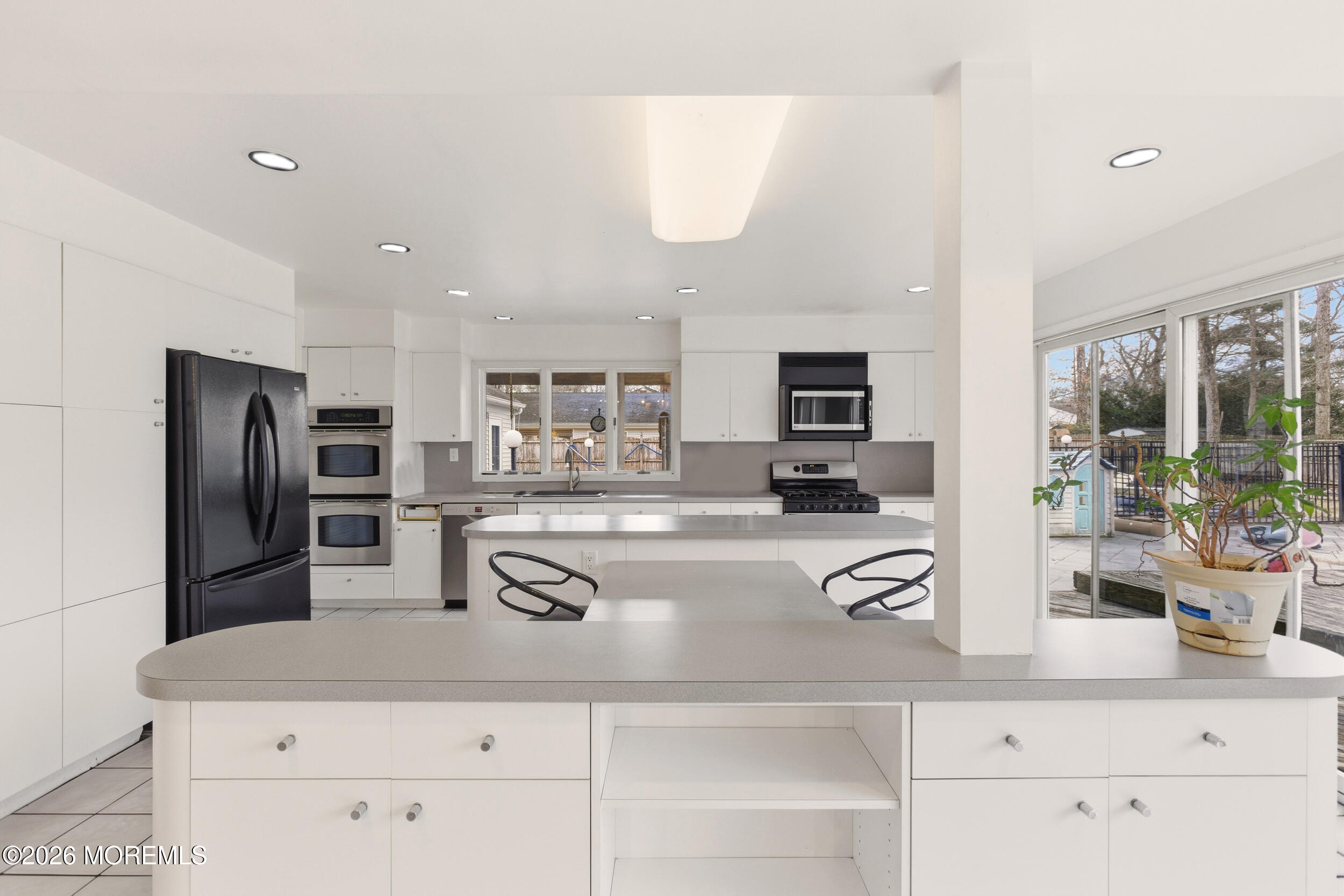 31 Chelsea Road Jackson, NJ 08527 - Photo 28 of 57 a kitchen with stainless steel appliances granite countertop a refrigerator and a sink