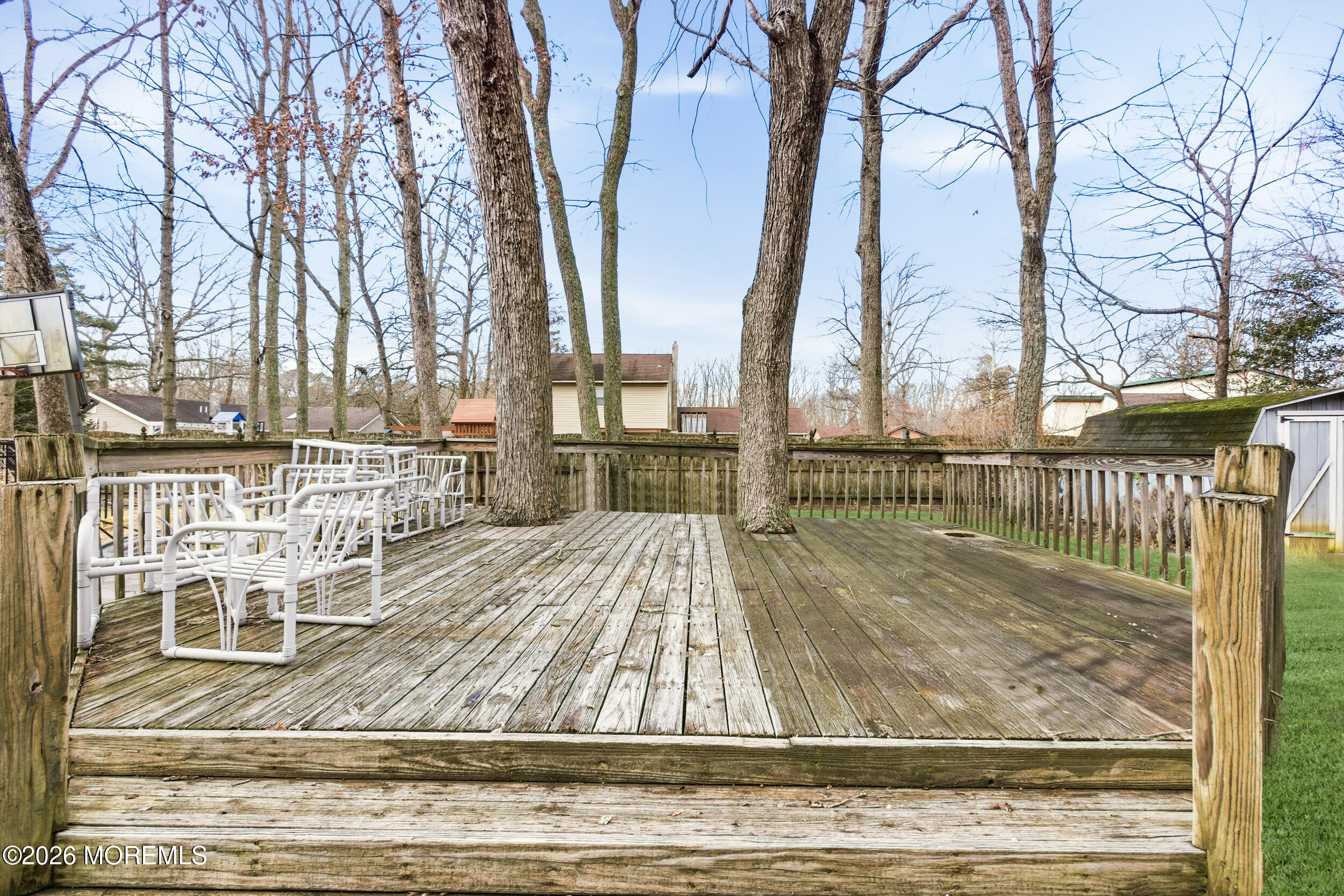 31 Chelsea Road Jackson, NJ 08527 - Photo 29 of 57 front view of a house with large trees and wooden fence